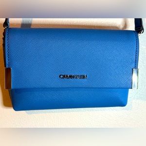 Blue Calvin Klein small hand bag.